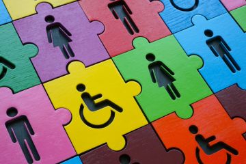 Multi-coloured puzzle with figures of people Multi-coloured puzzle with figures of people