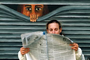 Mural peering at person reading newspaper Mural peering at person reading newspaper