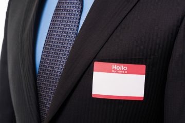 Businessman wearing blank name badge Businessman wearing blank name badge