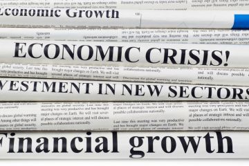 Newspaper front pages with economics headlines Newspaper front pages with economics headlines