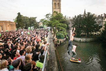 Men jumping into the river