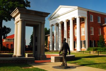 Oxford, MS, USA July 21, 2010 a statue of James Meredith, walking through an open door, honors the the first African American to attend the University of Mississippi