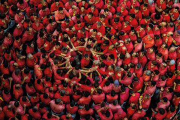 Crowd of people dressed in red Crowd of people dressed in red