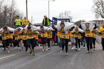 Women carrying sacks