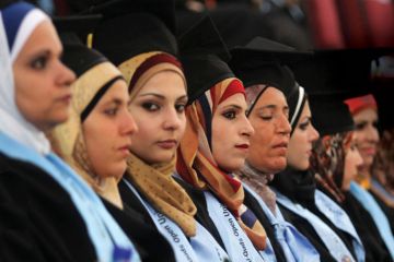 Palestinian students at Al-Quds Open University graduation ceremony