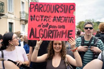 A high school student holds a red placard reading PARCOURSUP OUR FUTURE IS NOT AN ALGORITHM during a high school and university student demonstration in France A high school student holds a red placard reading PARCOURSUP OUR FUTURE IS NOT AN ALGORITHM during a high school and university student demonstration in France