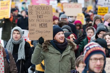 A protester holding a placard A protester holding a placard