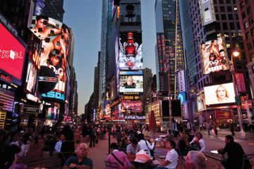 People eating in Times Square, New York City People eating in Times Square, New York City