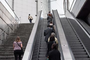 people going up escalator