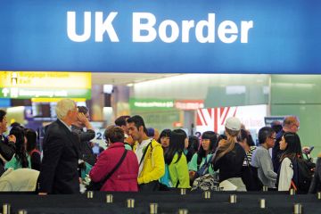 People queuing at UK border, Heathrow Airport, London People queuing at UK border, Heathrow Airport, London