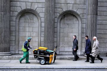 People walking outside Bank of England, London