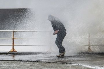 Person caught in spray of wave, Worcester, England Person caught in spray of wave, Worcester, England