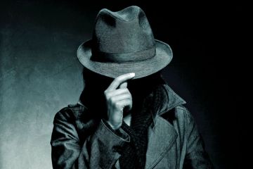 Person hiding face with hat brim Person hiding face with hat brim