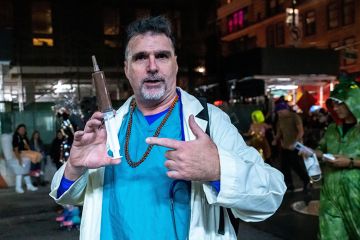 Person wearing a doctor's costume at the Halloween Parade in New York. To illustrate students obtaining fake doctor's notes.