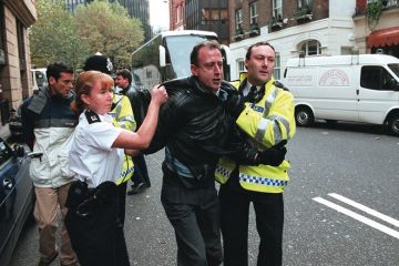 Peter Tatchell is arrested in London for protesting against Robert Mugabe