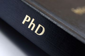 PhD lettered on book spine PhD lettered on book spine