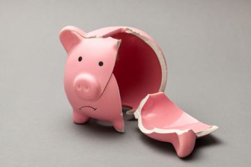 A broken piggy bank, symbolising in adequate master's loans A broken piggy bank, symbolising in adequate master's loans