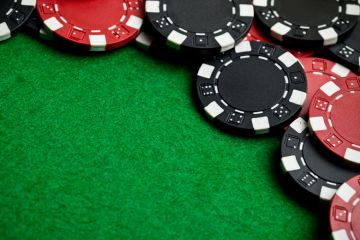 Pile of casino chips on gambling table Pile of casino chips on gambling table