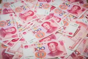 Pile of Chinese currency 100s of yuan Pile of Chinese currency 100s of yuan