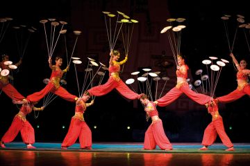 Acrobats spinning plates