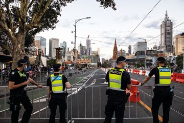 Members of Victoria Police patrol St. Kilda Road, Melbourne Members of Victoria Police patrol St. Kilda Road, Melbourne