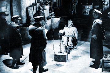 Interrogation of a prisoner of war, illustrating the sometimes intimidating nature of the viva voce exam in the UK.