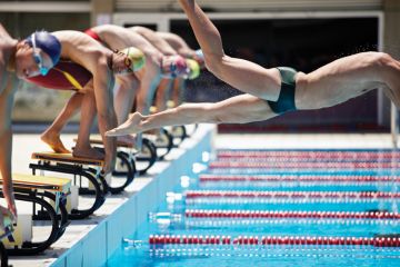 Professional swimmer diving on false start