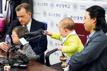 Robert Kelly with his wife Jung-a Kim and children Marion and James, who interrupted his live TV interview on South Korean politics Robert Kelly with his wife Jung-a Kim and children Marion and James, who interrupted his live TV interview on South Korean politics
