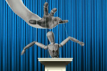 Puppet at a lectern. To illustrate comments made by David Willetts that government should stop trying to micromanage university provision Puppet at a lectern. To illustrate comments made by David Willetts that government should stop trying to micromanage university provision