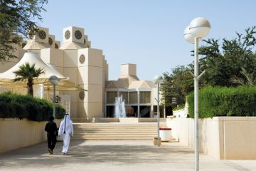 Qatar University students walking on campus
