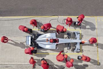 racing team working at pit stop