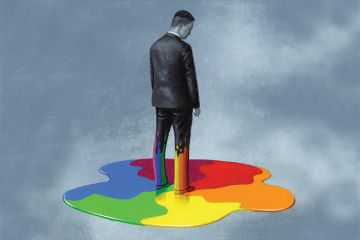 A man in a suit standing in rainbow paint (illustration 21 June 2018) A man in a suit standing in rainbow paint (illustration 21 June 2018)