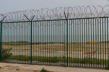 Razor wire guarding ferry terminal in Calais, France Razor wire guarding ferry terminal in Calais, France