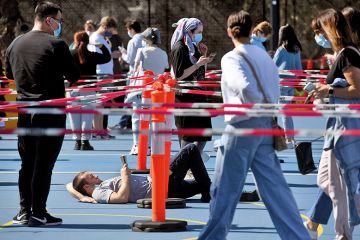 There is value in the simplicity of my open access proposal for Australia Man reading book in vaccination queue