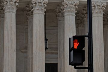 Red hand stop sign in from of classical columns to illustrate that serious abuses should stop being investigated only by universities. Red hand stop sign in from of classical columns to illustrate that serious abuses should stop being investigated only by universities.