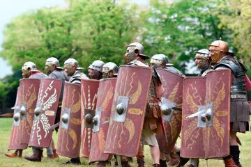 reenactment of Roman legionary during battle reenactment of Roman legionary during battle