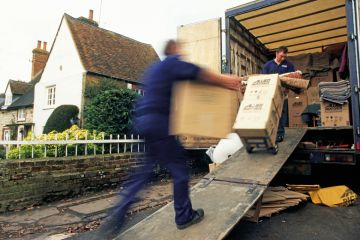 Removal men loading home contents into truck Removal men loading home contents into truck