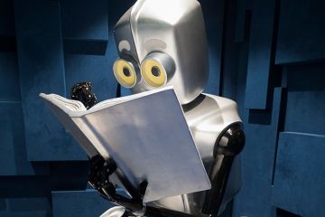  A robot reading a book, to illustrate a UK trial of artificial intelligence marking tools.