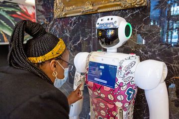 A woman interacts with robot in Johannesburg, South Africa. To illustrate that Africa has a crucial role in advancing the study of AI. A woman interacts with robot in Johannesburg, South Africa. To illustrate that Africa has a crucial role in advancing the study of AI.