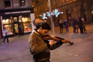 Roma youth playing violin