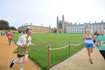 Runners at Cambridge University, illustrating that dozens of academics are chasing each research post at Oxbridge.