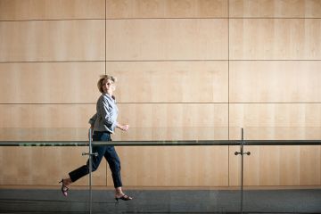 woman running through corridor