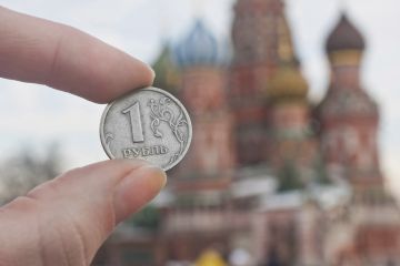 Ruble held by st.Basil's Cathedral