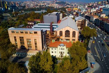 One of three campuses of İstanbul Bilgi University, located next to a busy road