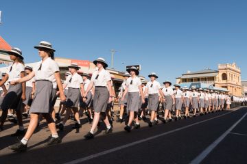 School children marching on Anzac Day in Charters Towers, Queensland, Australia School children marching on Anzac Day in Charters Towers, Queensland, Australia