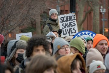 Participant seen holding a sign as hundreds of Academic Workers gathered at Washington Square Park in Manhattan for a protest against the Trump administration's freezing of public funding for science research, 19 February 2025