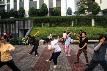 People practise tai chi in Singapore