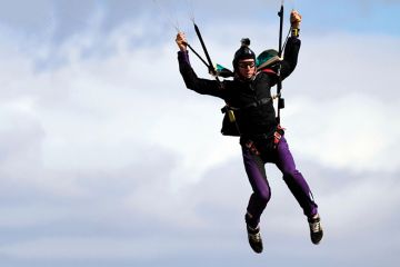 skidiver landing afterjumping from a plane skidiver landing afterjumping from a plane