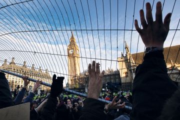 Student fees protesters attempt to throw a fence at police in Parliament Square in December 2010 in London Student fees protesters attempt to throw a fence at police in Parliament Square in December 2010 in London