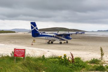 Small plane on the sandy runway of Barra Airport, Scotland